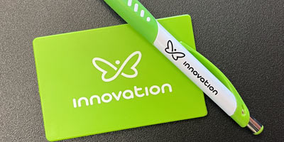 Innovation logo on a pen and card