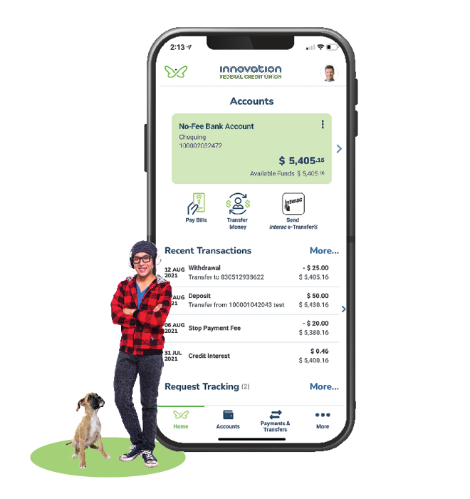 Young man and dog standing in front of large mobile phone and debit card