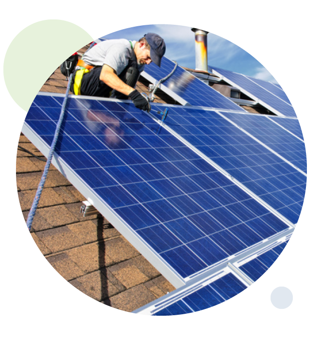 Man putting up solar panels on home