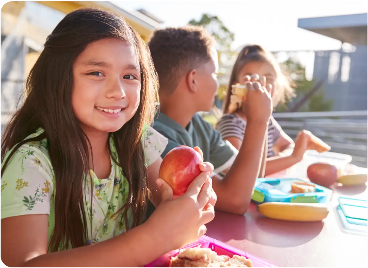 Young Female Student Enjoying a Lunch Program