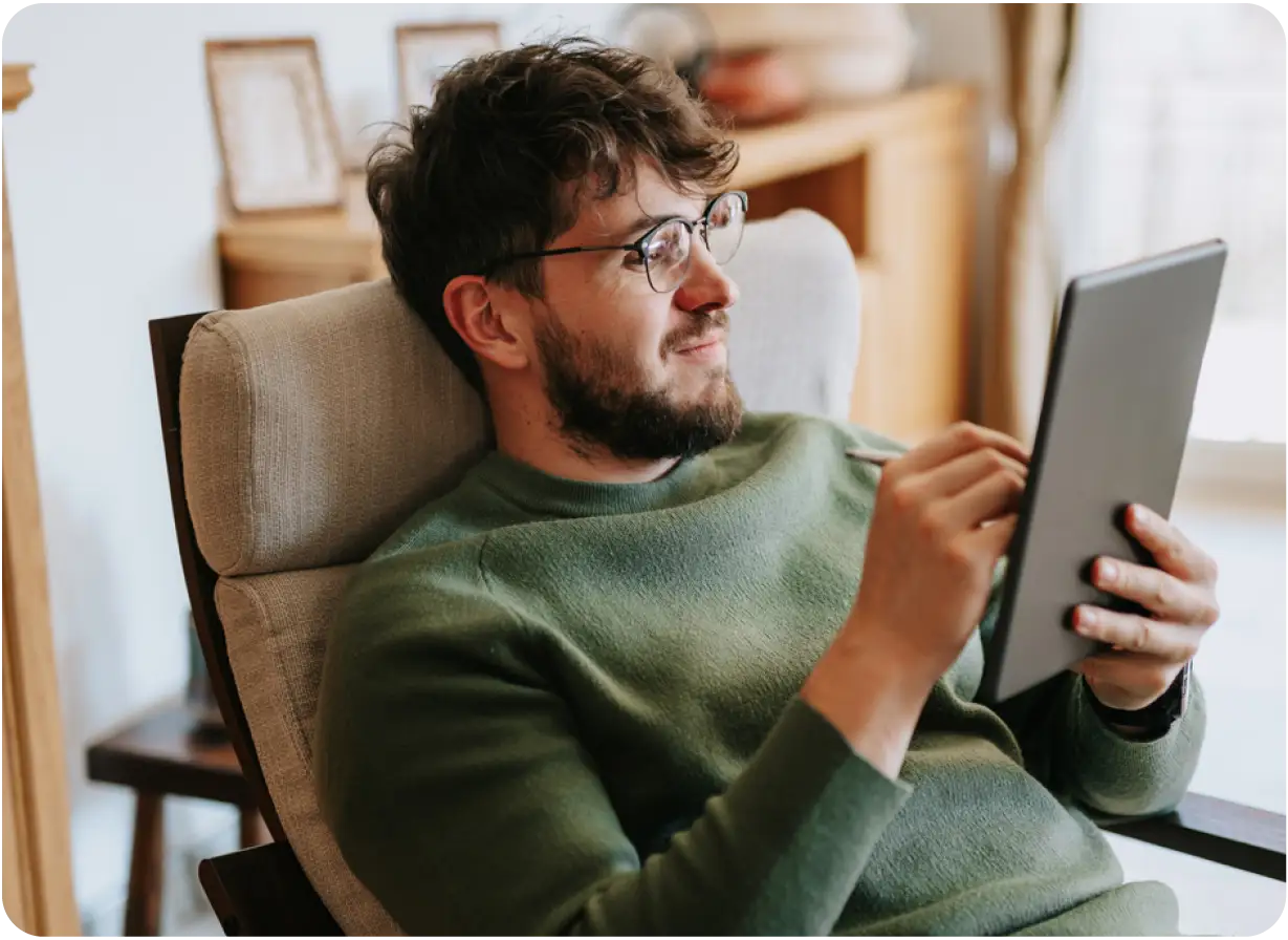Man Looking at Tablet