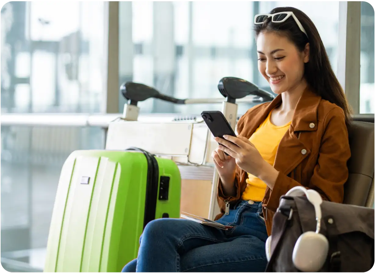 Smiling Woman Sitting in Airport