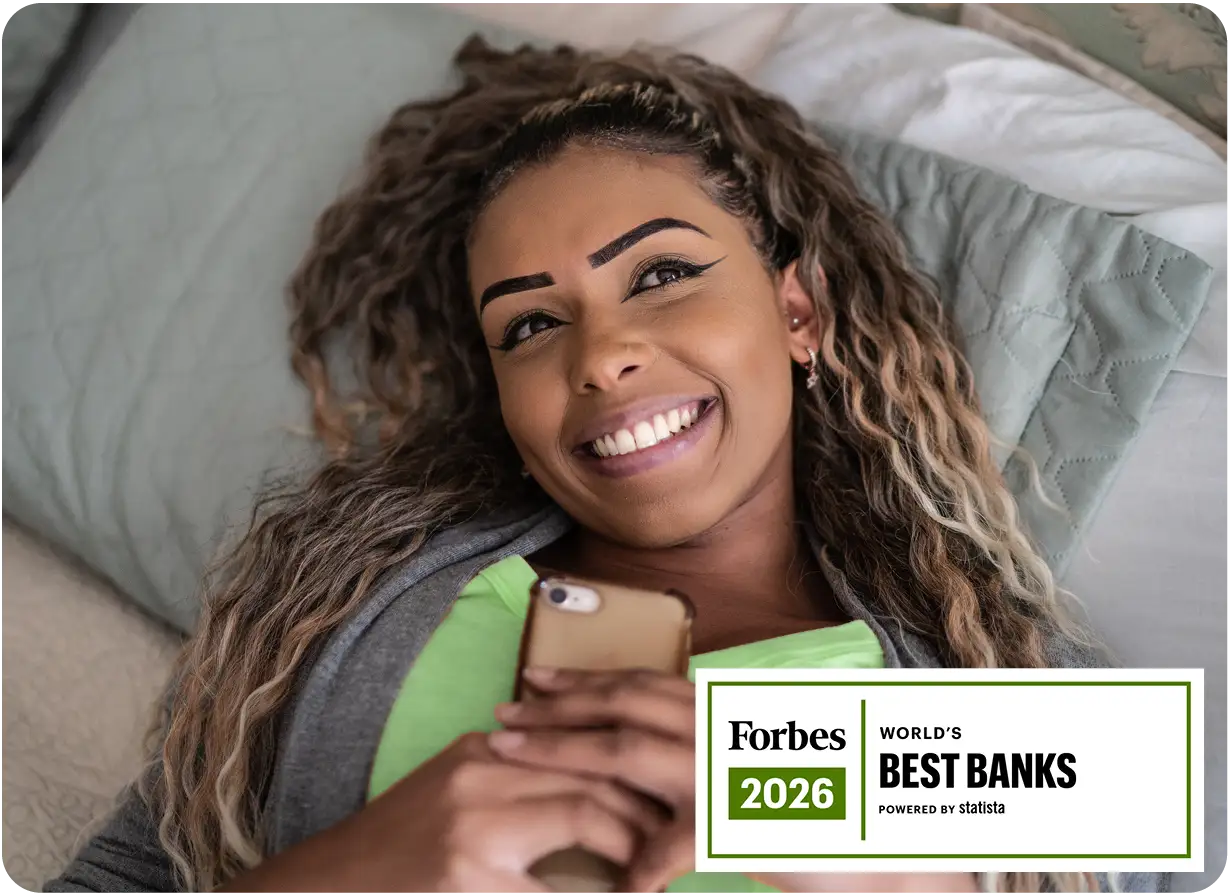 Woman Relaxing Holding Phone Forbes Logo
