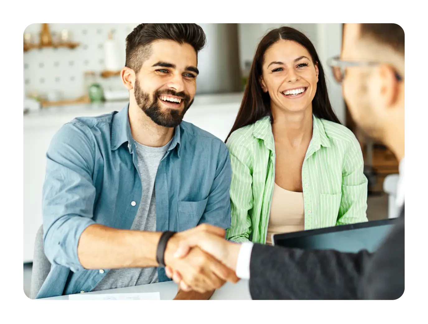 Couple Shaking Hands with Advisor