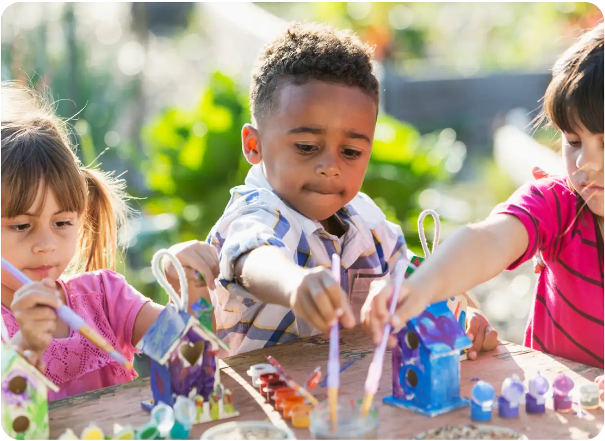 Children Painting in Park Play Program