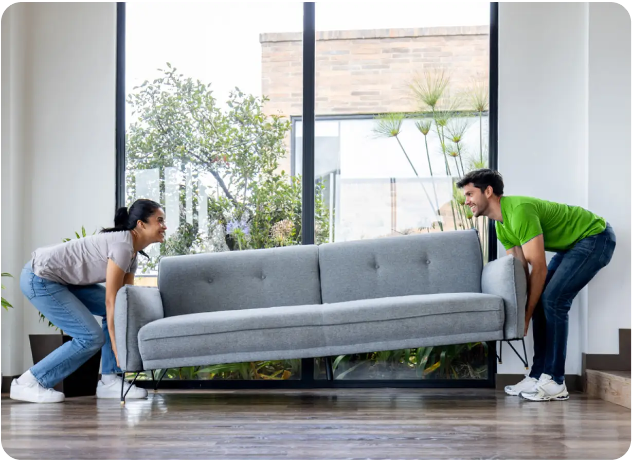 Couple Moving New Couch in Home