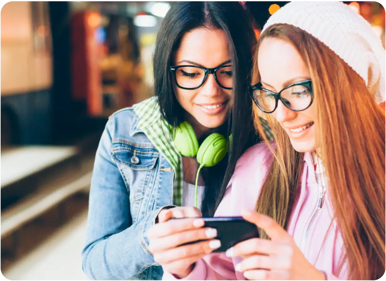 Women Looking at Phone Screen