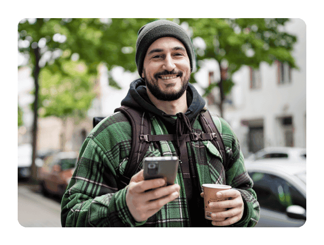 Man Holding Phone and Coffee