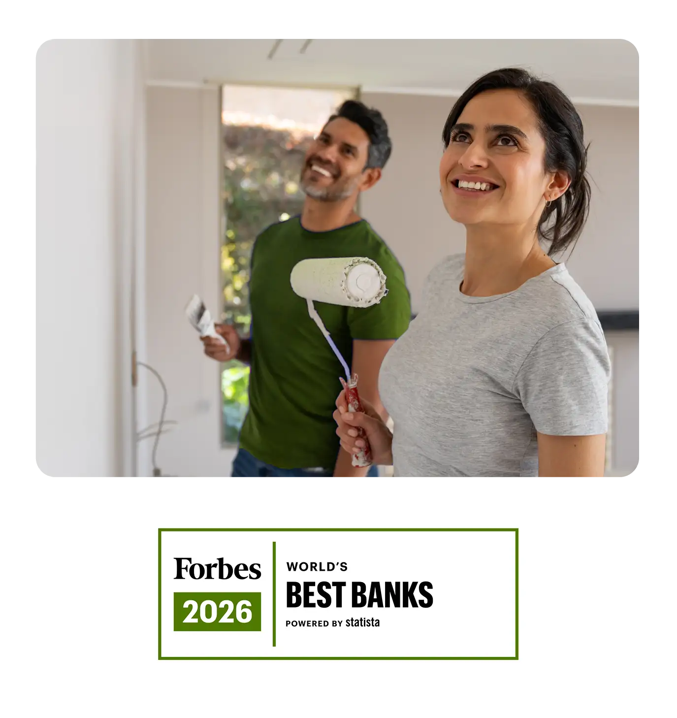 A couple happily painting a room together with the Forbes World's Best Banks 2026 award badge.