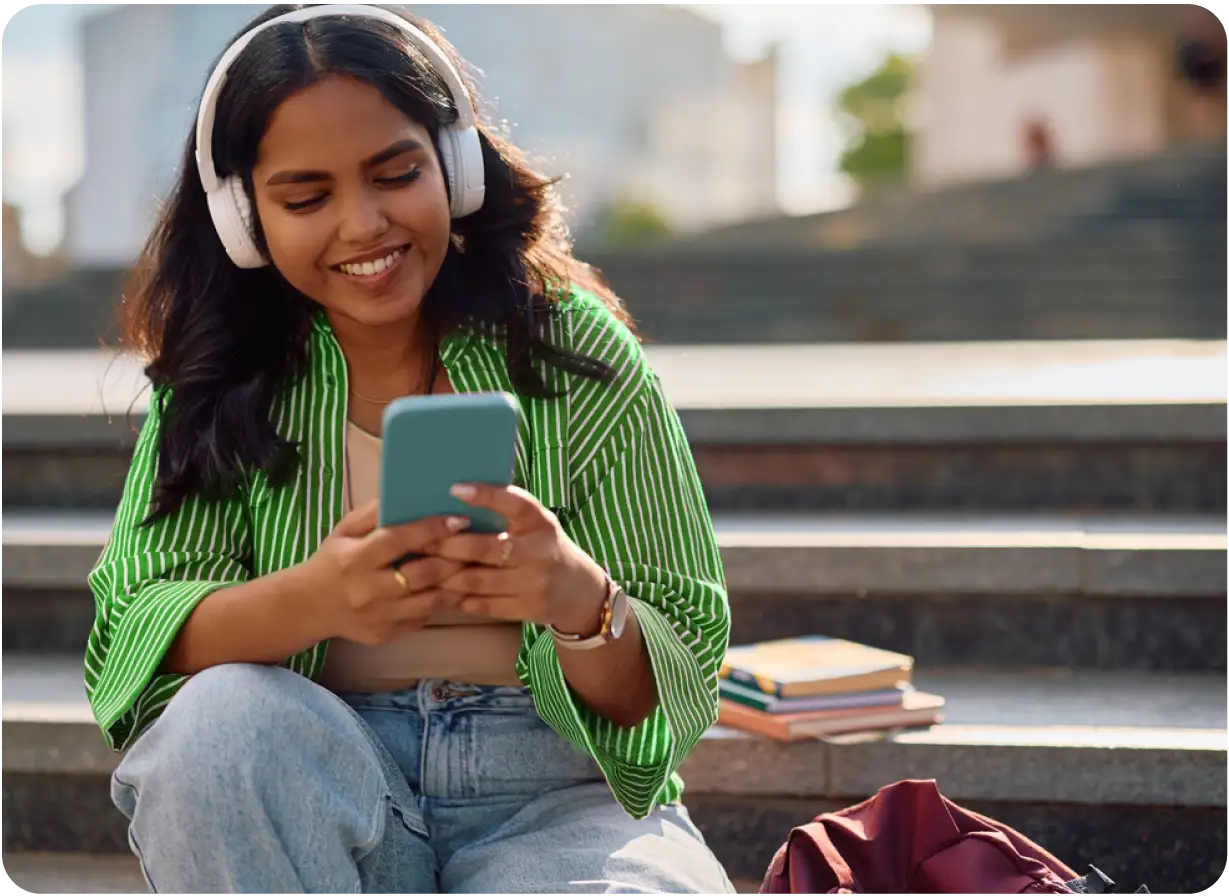 Female Student Looking at Phone Screen