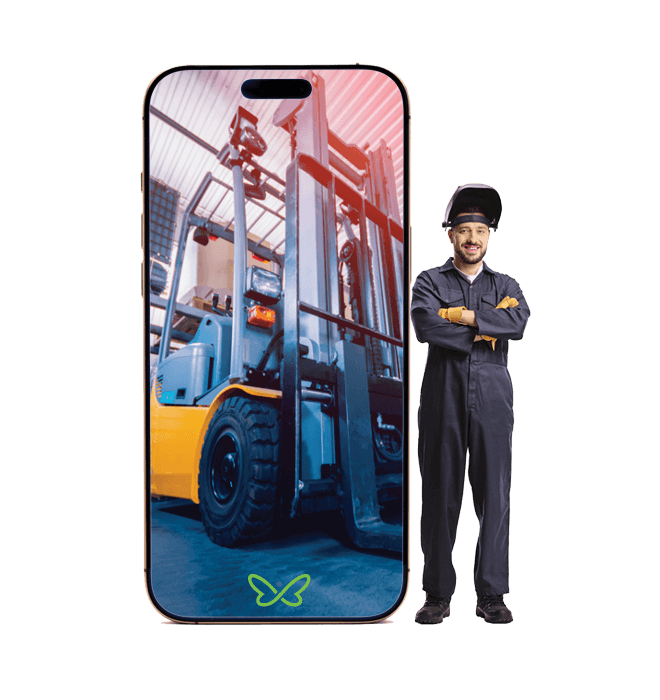 A welder standing beside an oversized phone displaying a forklift