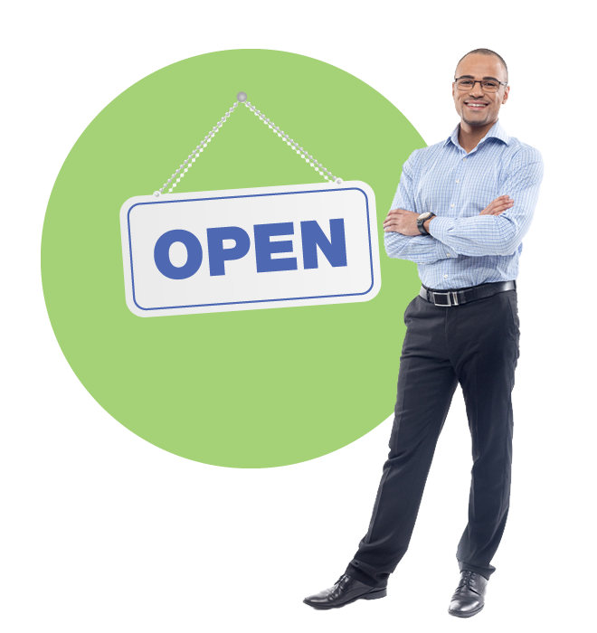 A businessman standing next to an open sign