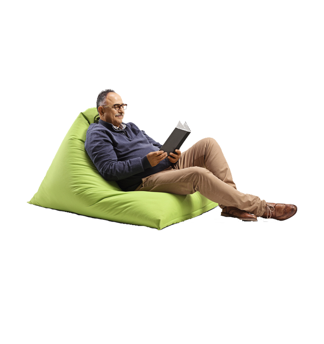 A man reading in a bean bag chair