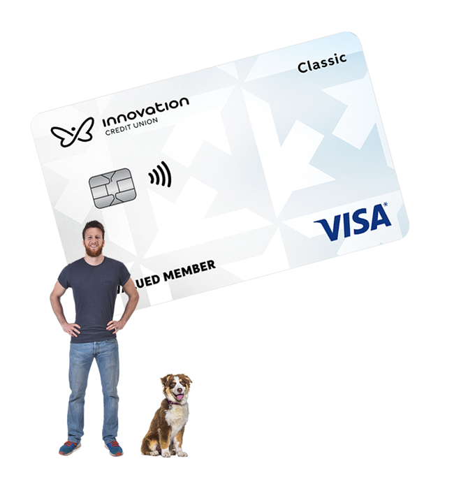 Smiling man and dog standing in front of large Classic Visa card