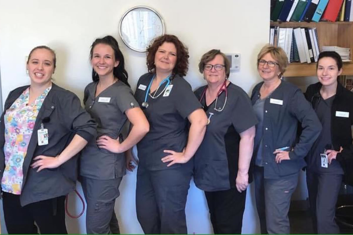 Group of female healthcare workers in scrubs
