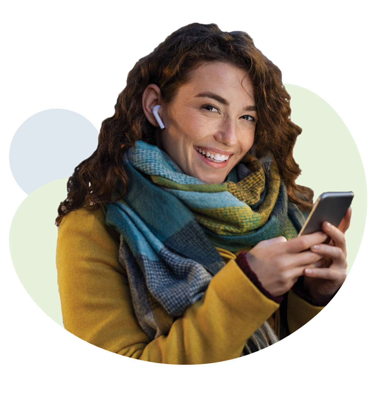Happy young woman holding mobile phone