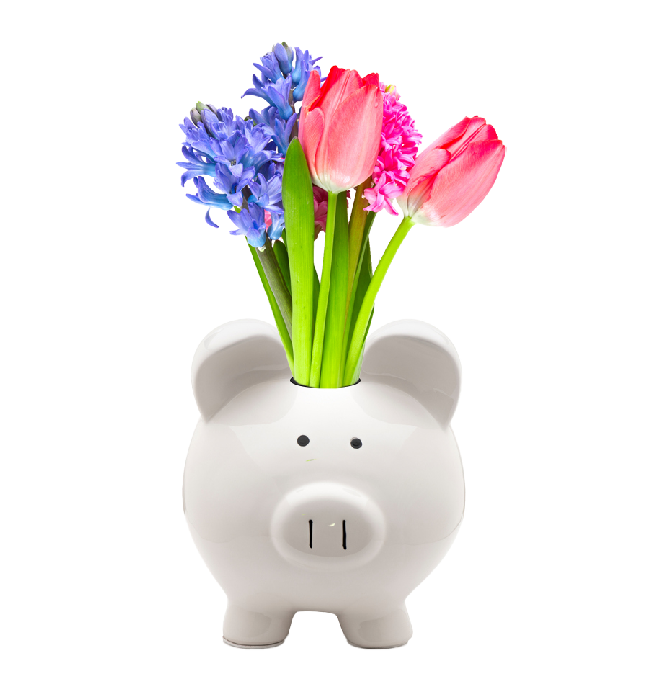A white piggy bank with a bouquet of flowers coming out the coin slot