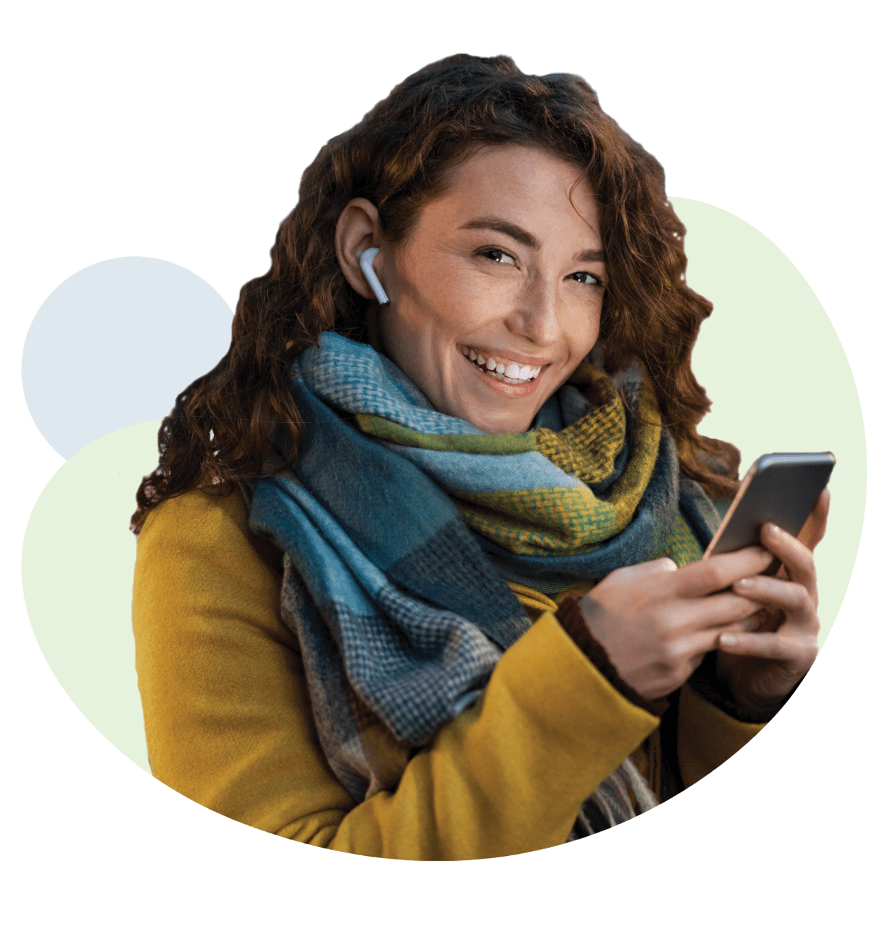 Happy young woman holding mobile phone