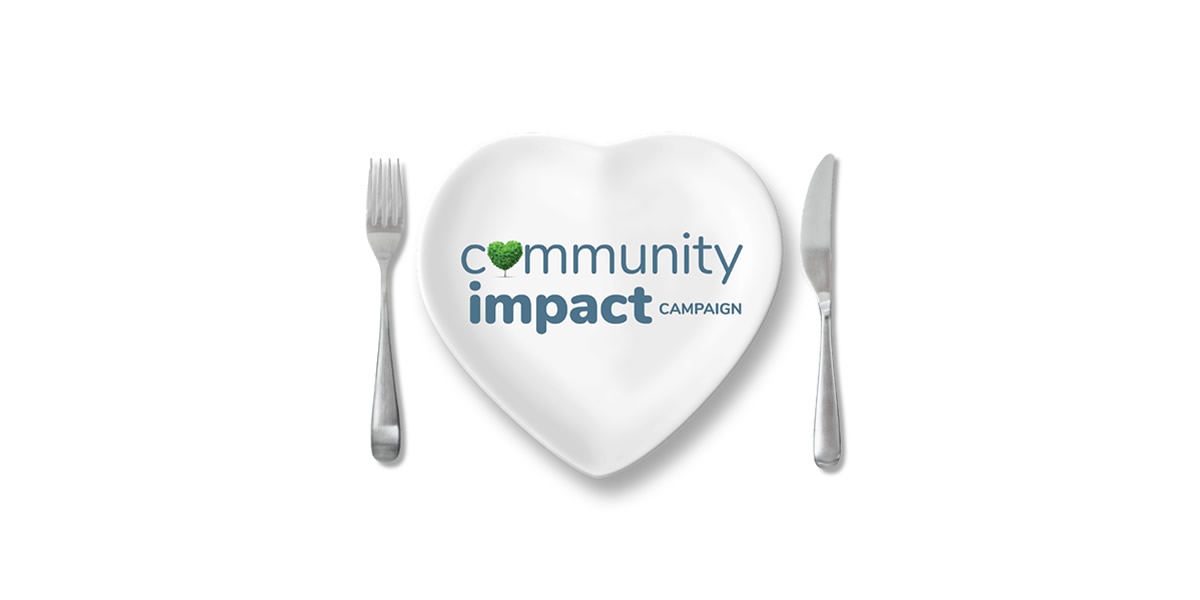 A heart plate with the Community Impact logo on it