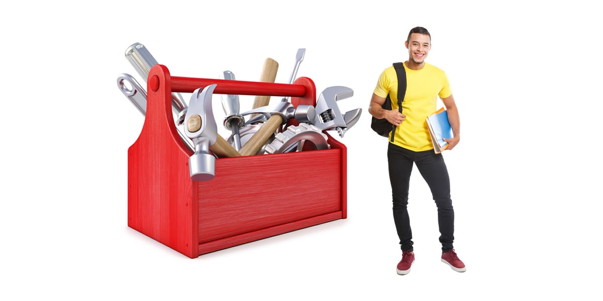 A male student standing in front of a large tool box