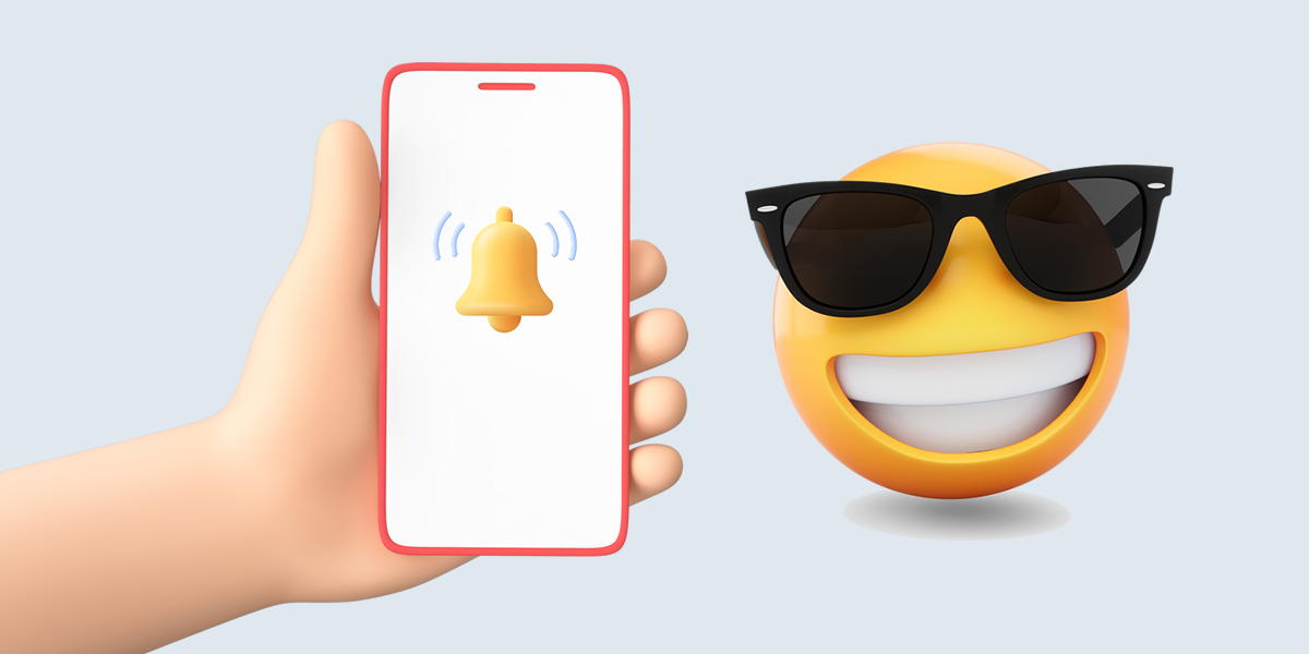 A smiling emoji beside a mobile phone with an alert bell on the screen