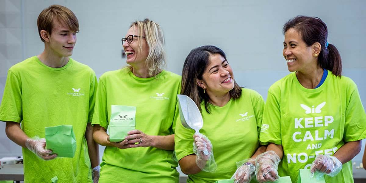 Innovation volunteers bagging popcorn