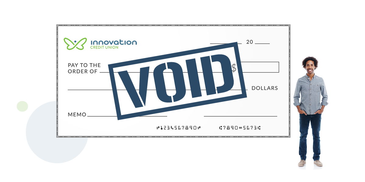 Large void cheque with man standing beside it
