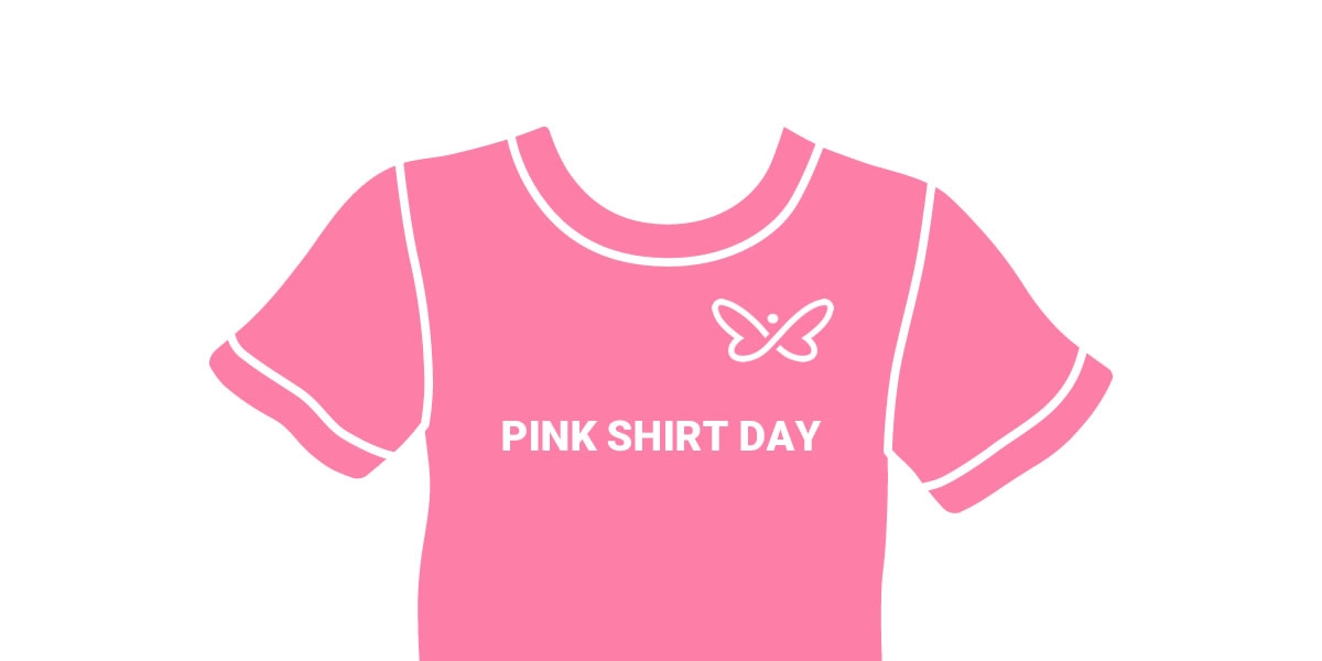A pink t-shirt with the Innovation butterfly icon and words "Pink Shirt Day" on the front of the shirt