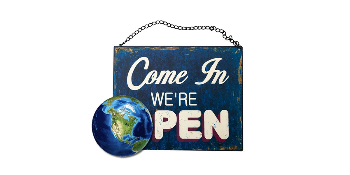 Come in we're open sign with a globe used for the O in Open
