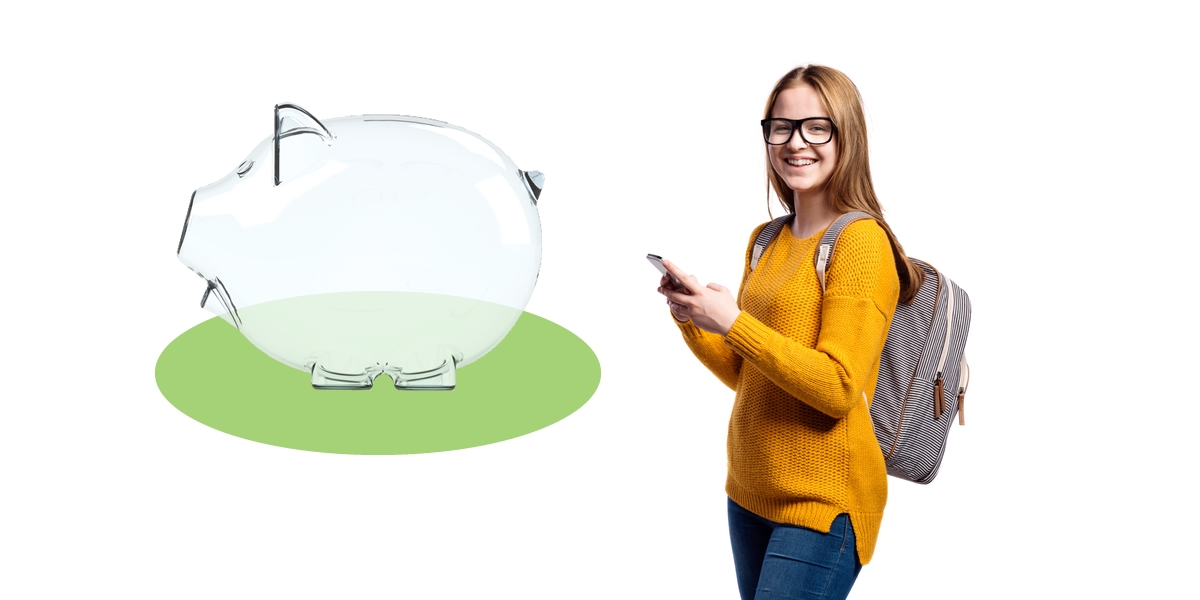 Happy teenager standing beside large piggy bank