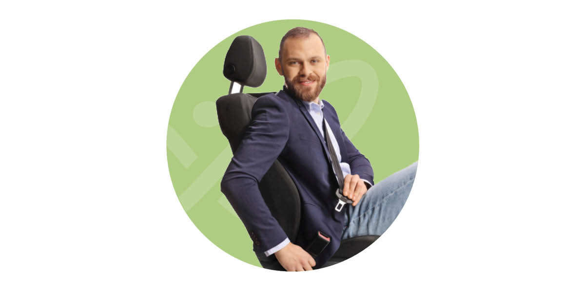 Happy man doing up his seatbelt