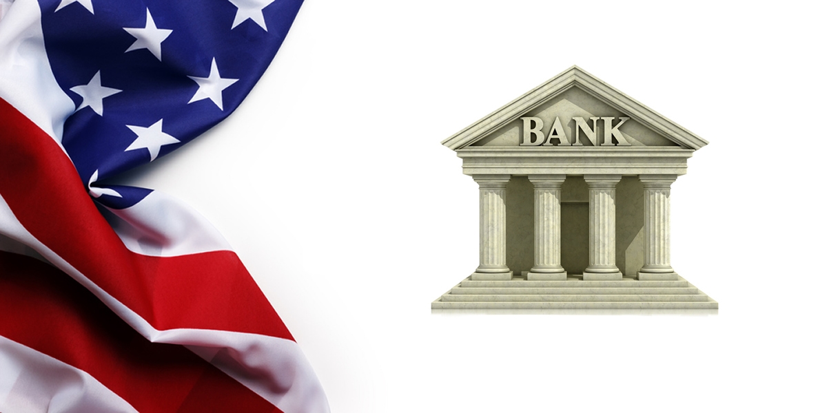 A US flag beside a bank