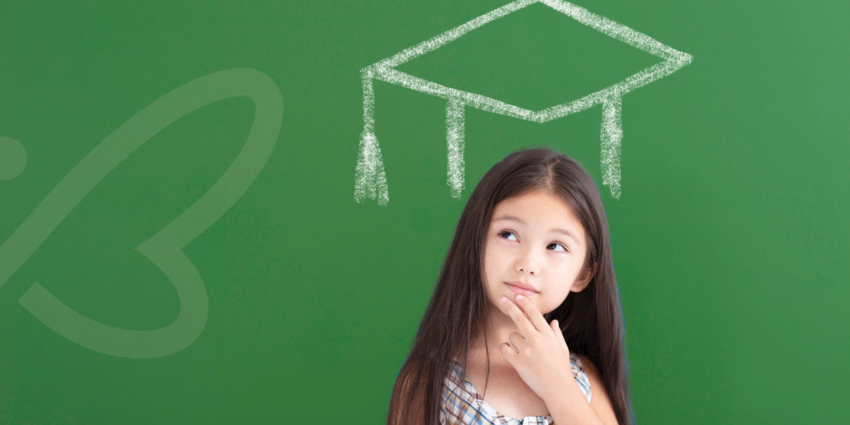 Young Girl with Grad Cap Drawn on Chalkboard