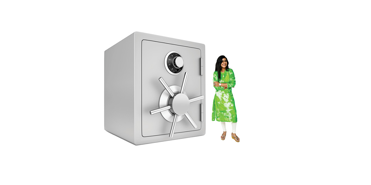 Woman standing beside large safe