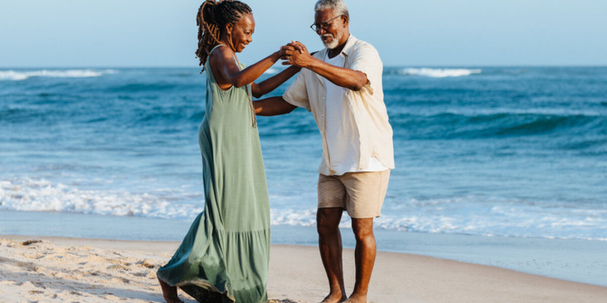 Couple dancing on beach