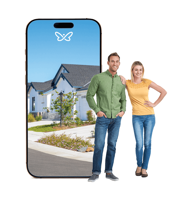Couple Standing Beside Large Phone Displaying a Neighbourhood
