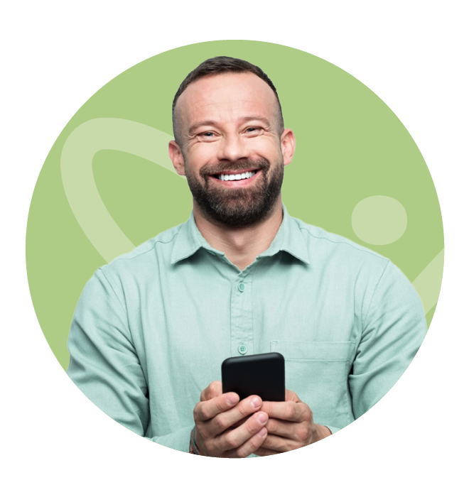 Smiling man holding a cell phone